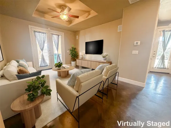 a living room with furniture and a flat screen tv