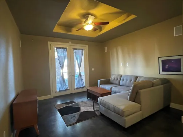a living room with furniture and a window