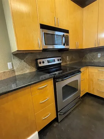 a kitchen with a stove and a microwave