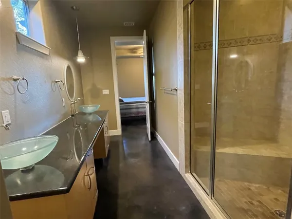 a bathroom with a tub and shower