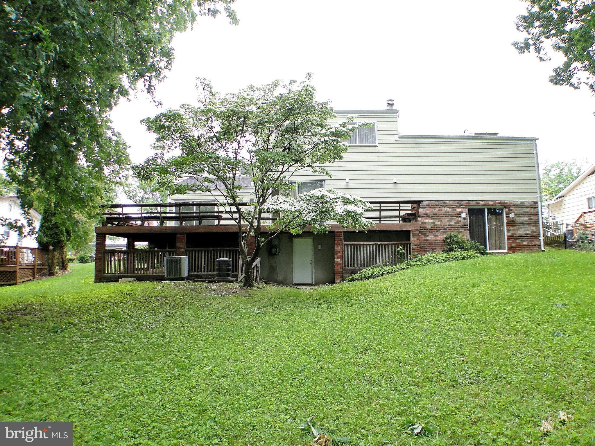 8232 Brattle Road Pikesville, MD 21208 - Photo 2 of 30 a view of a house with a backyard