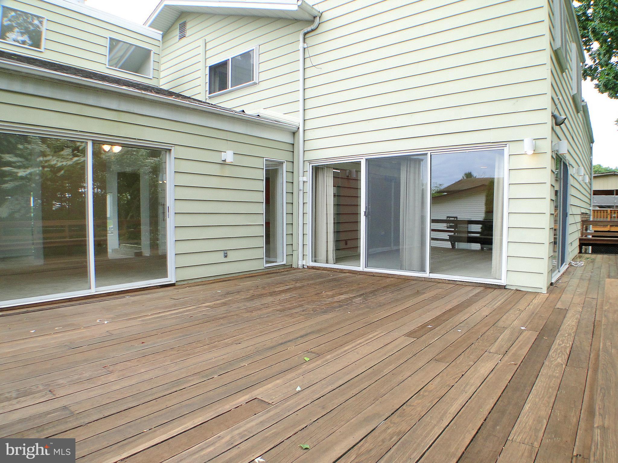 8232 Brattle Road Pikesville, MD 21208 - Photo 16 of 30 a view of a house with a backyard