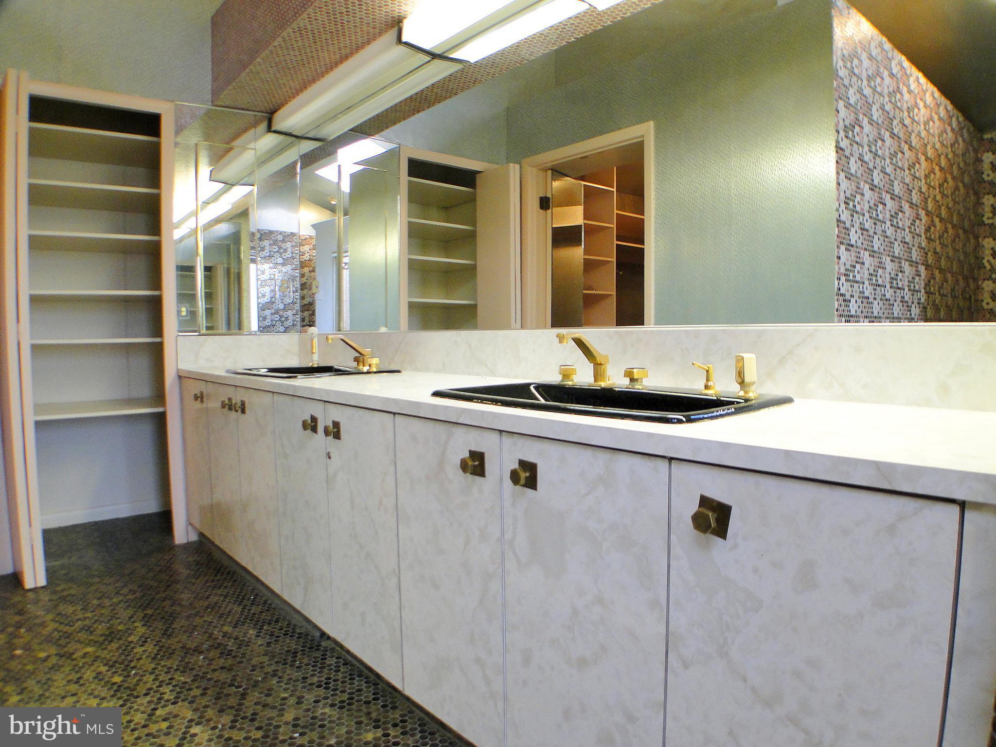 8232 Brattle Road Pikesville, MD 21208 - Photo 22 of 30 a kitchen with a sink and cabinets