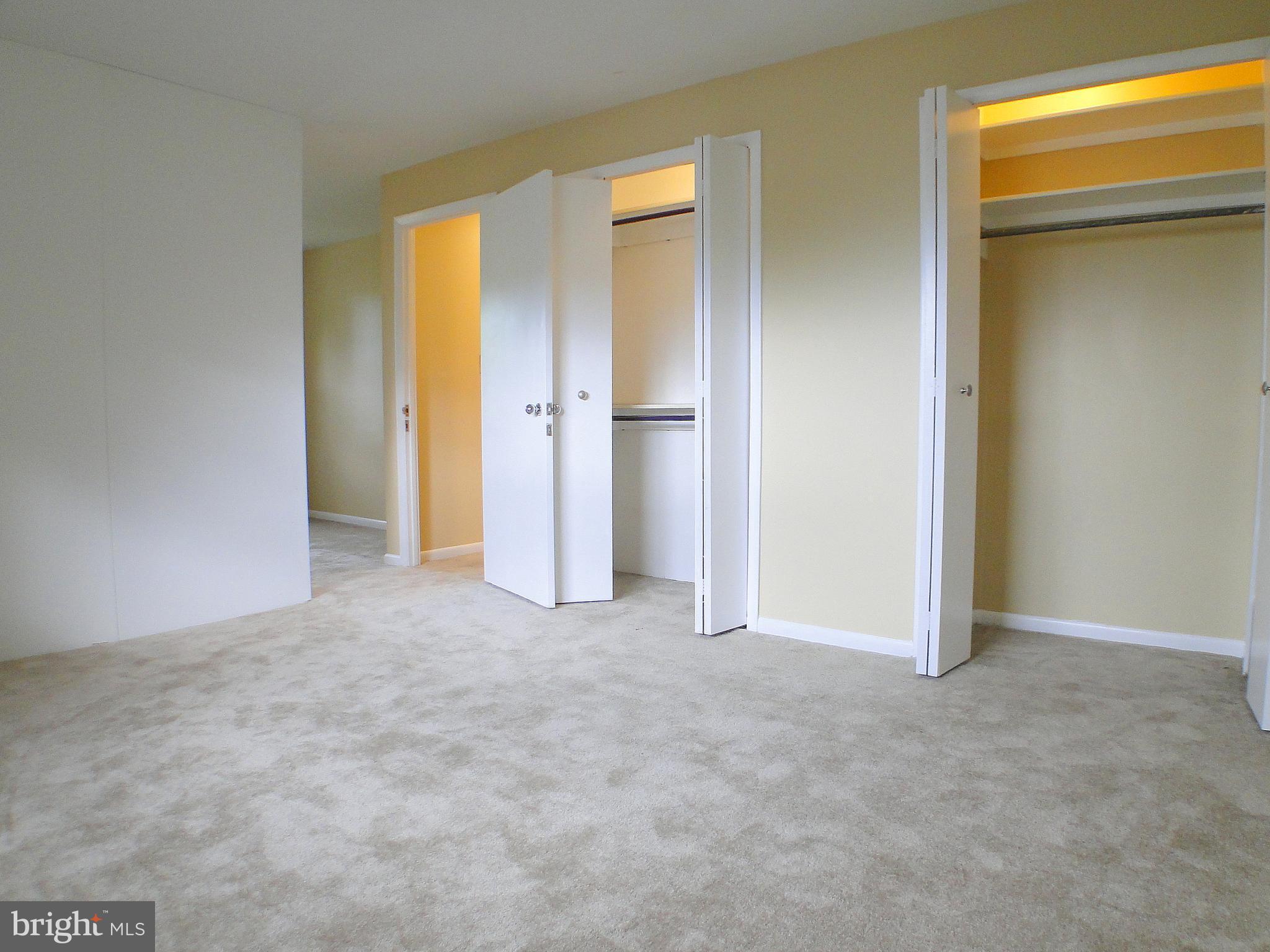8232 Brattle Road Pikesville, MD 21208 - Photo 23 of 30 a view of an empty room with closet and a window