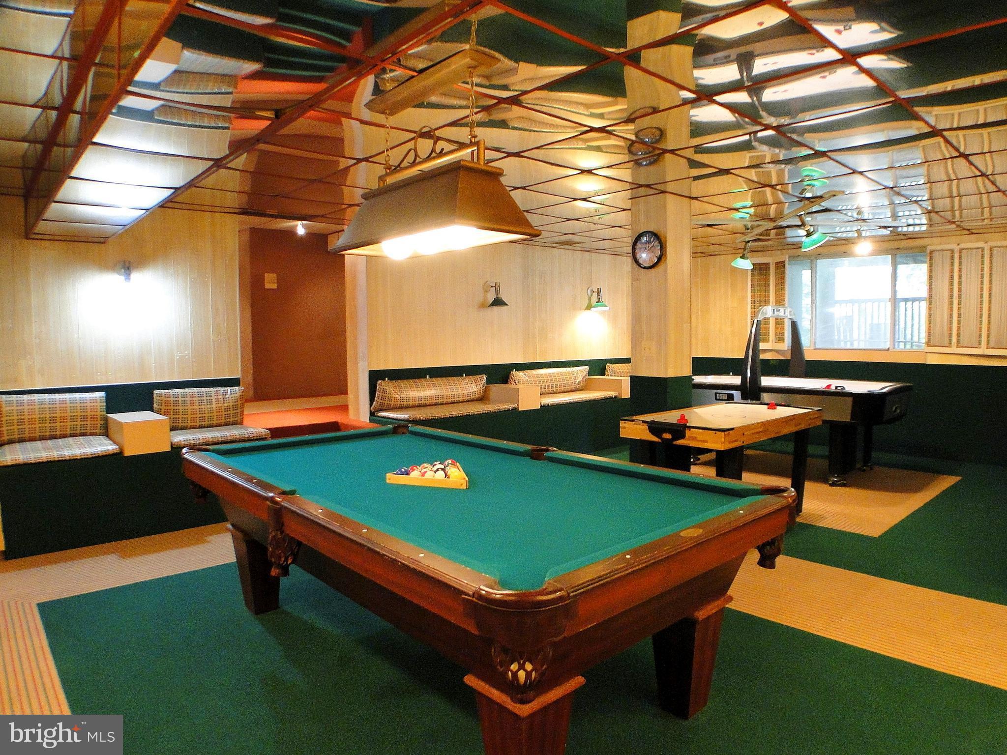 8232 Brattle Road Pikesville, MD 21208 - Photo 29 of 30 a room with pool table table and a chandelier