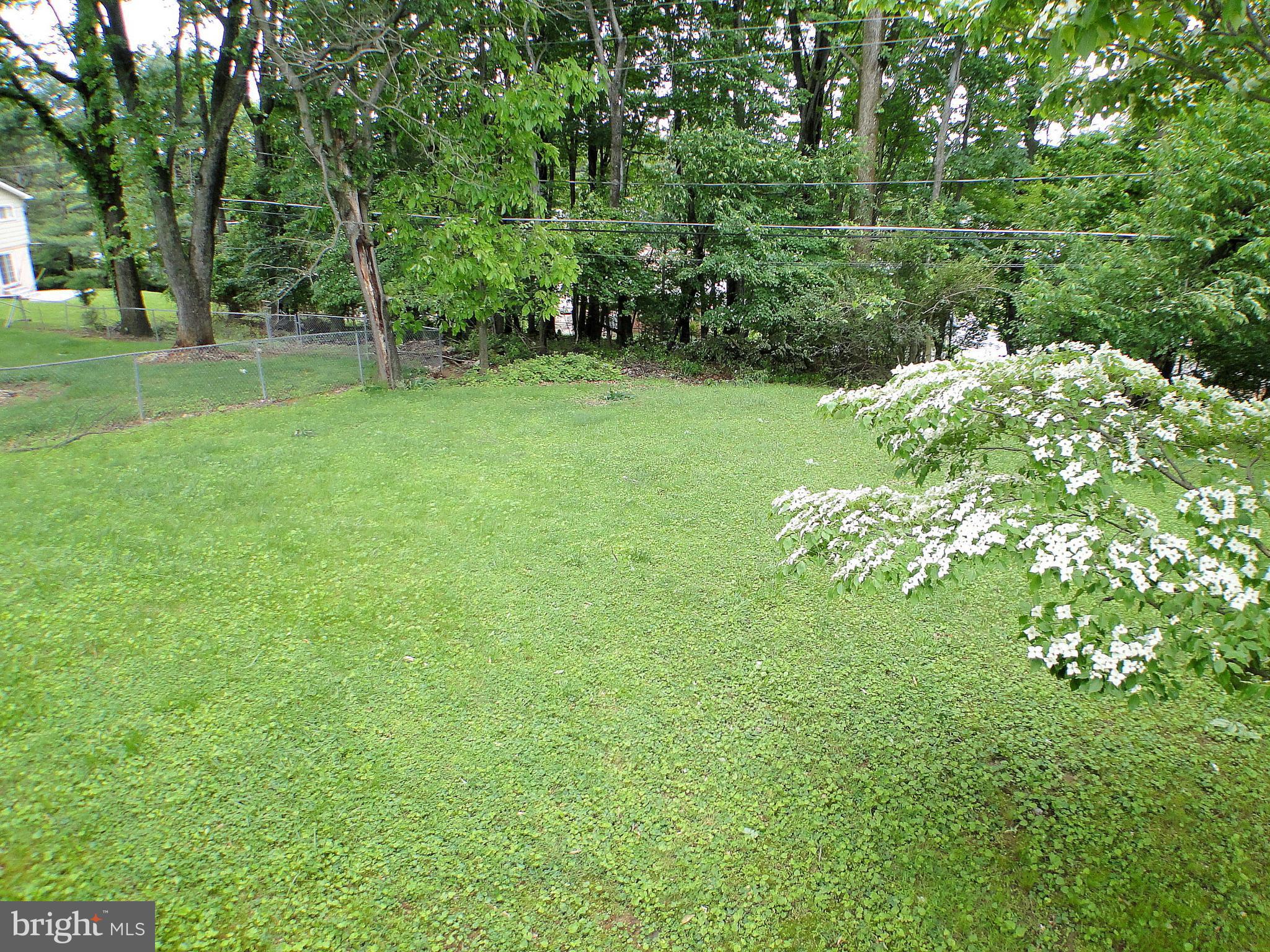 8232 Brattle Road Pikesville, MD 21208 - Photo 30 of 30 a backyard of a house with lots of green space