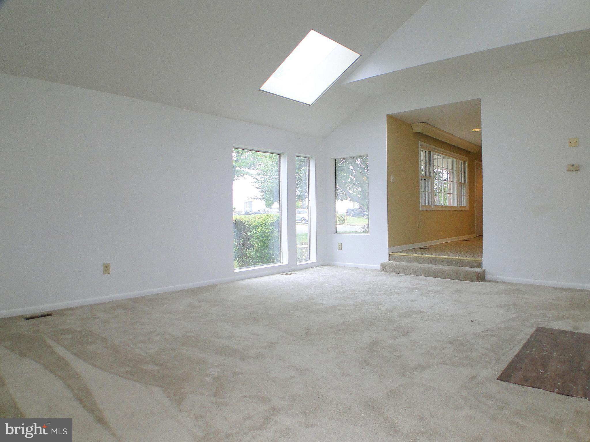 8232 Brattle Road Pikesville, MD 21208 - Photo 4 of 30 a view of an empty room with a window