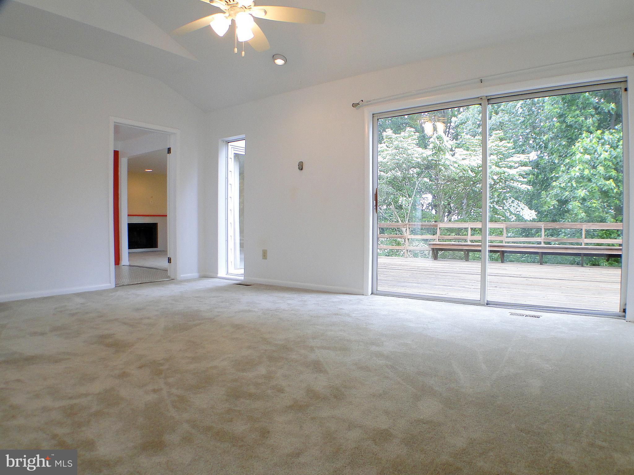 8232 Brattle Road Pikesville, MD 21208 - Photo 6 of 30 a view of an empty room with a balcony