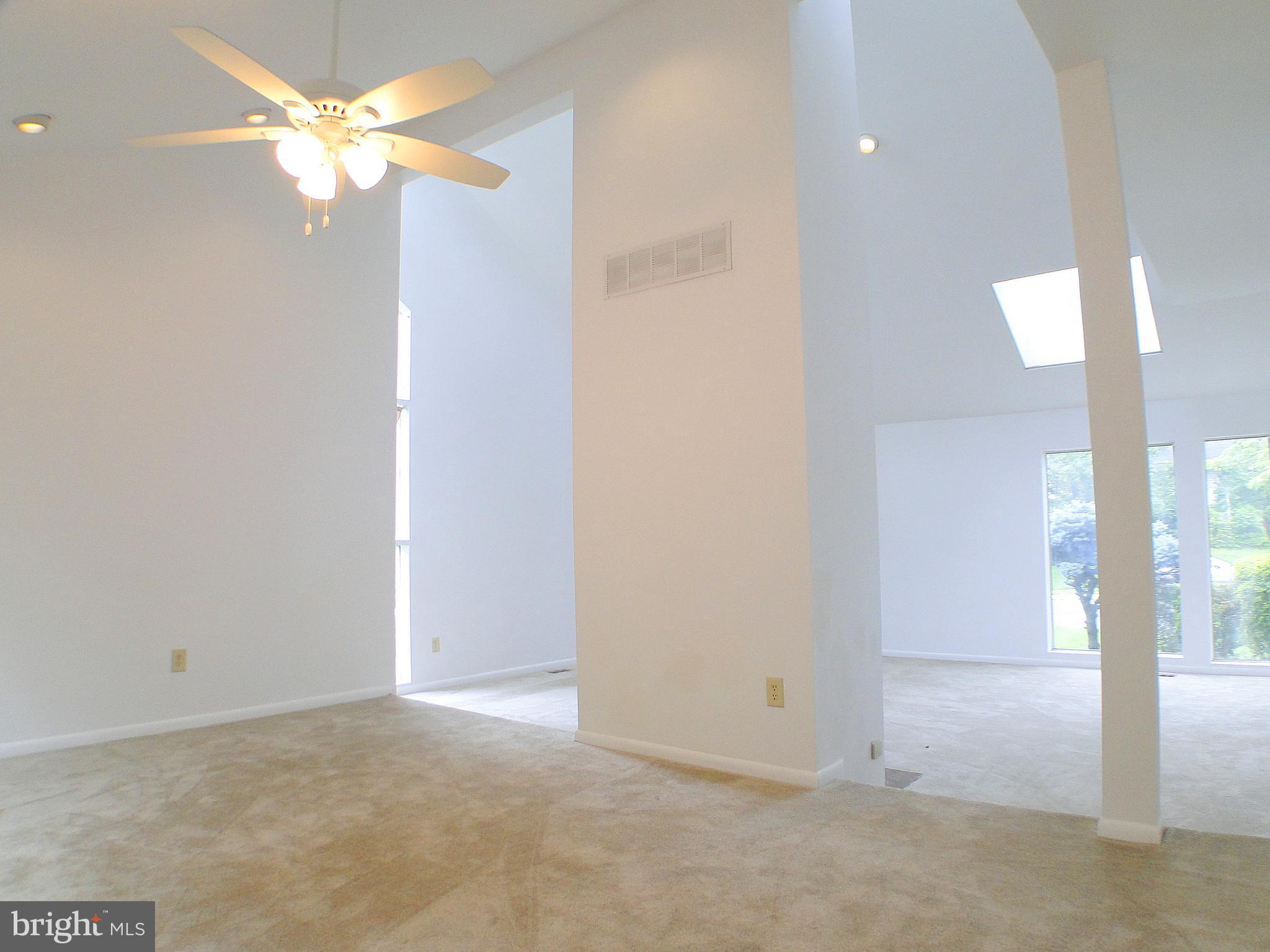8232 Brattle Road Pikesville, MD 21208 - Photo 7 of 30 a view of an empty room with a fan