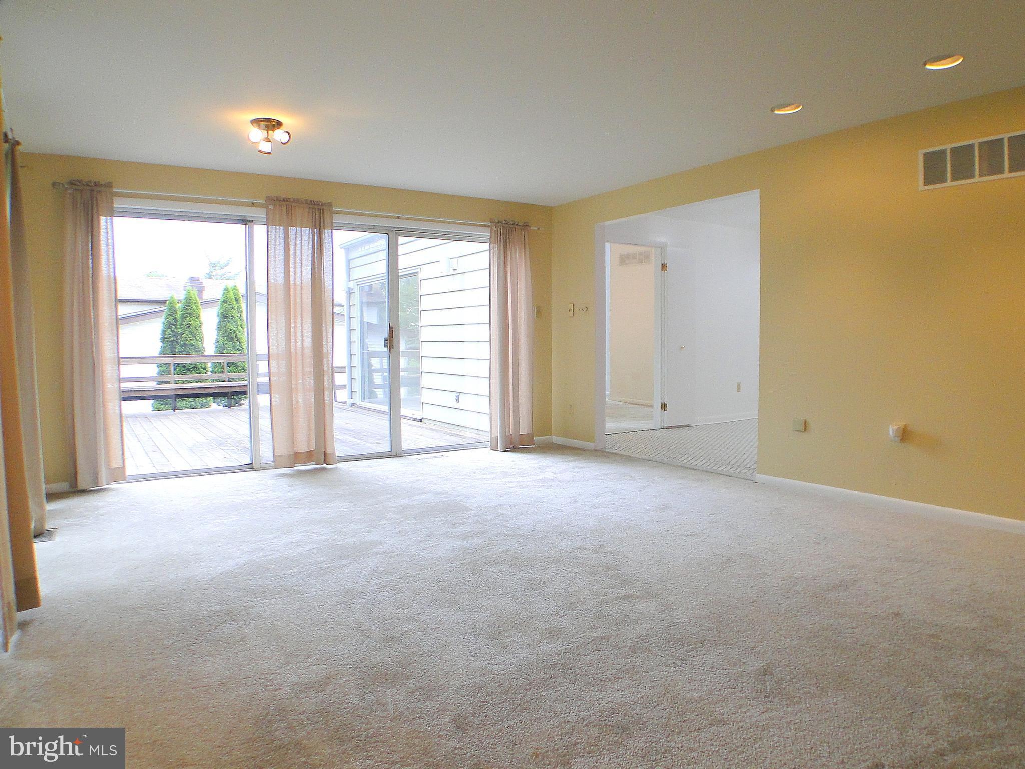 8232 Brattle Road Pikesville, MD 21208 - Photo 8 of 30 a view of an empty room with a window