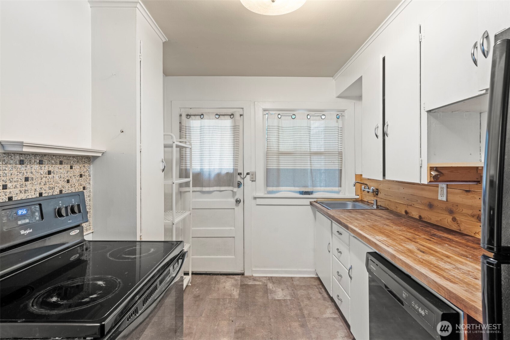 1768 Alki Avenue Southwest Seattle, WA 98116 - Photo 30 of 40 a kitchen with a sink stove and microwave