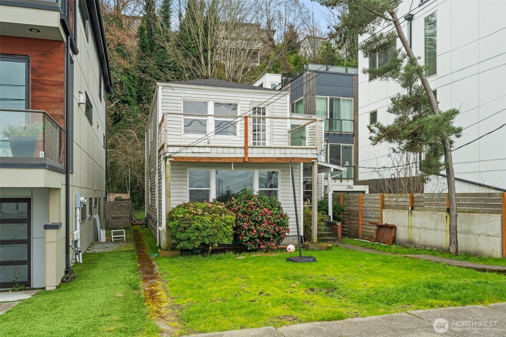 1768 Alki Avenue Southwest Seattle, WA 98116 - Photo 36 of 40 a front view of a house with a garden