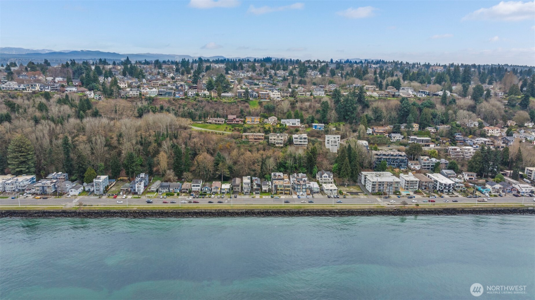 1768 Alki Avenue Southwest Seattle, WA 98116 - Photo 6 of 40 a view of a lake with beach