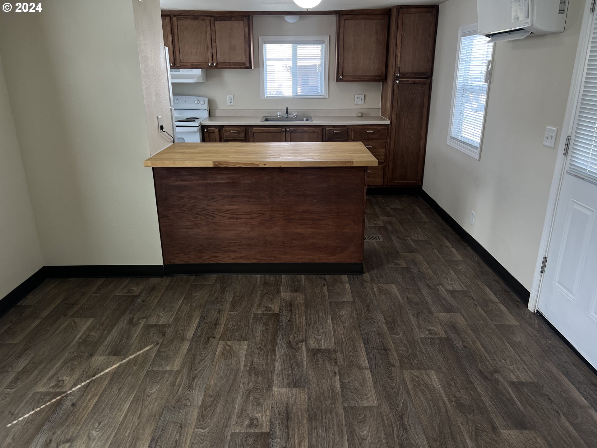 2150 Laura Street, Unit 78 Springfield, OR 97477 - Photo 8 of 20 a kitchen with granite countertop a sink stove and cabinets