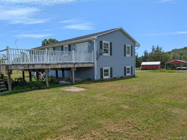 a house that has a big yard in front of it