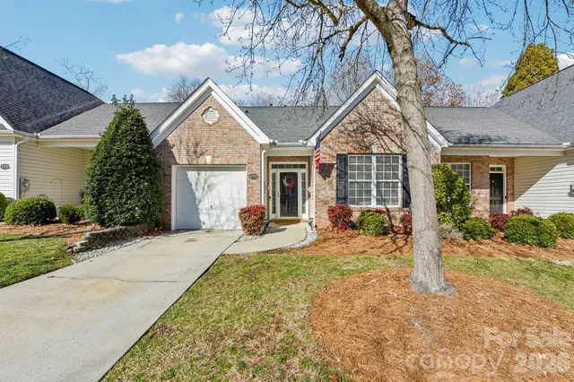 a front view of house with yard outdoor seating and barbeque oven