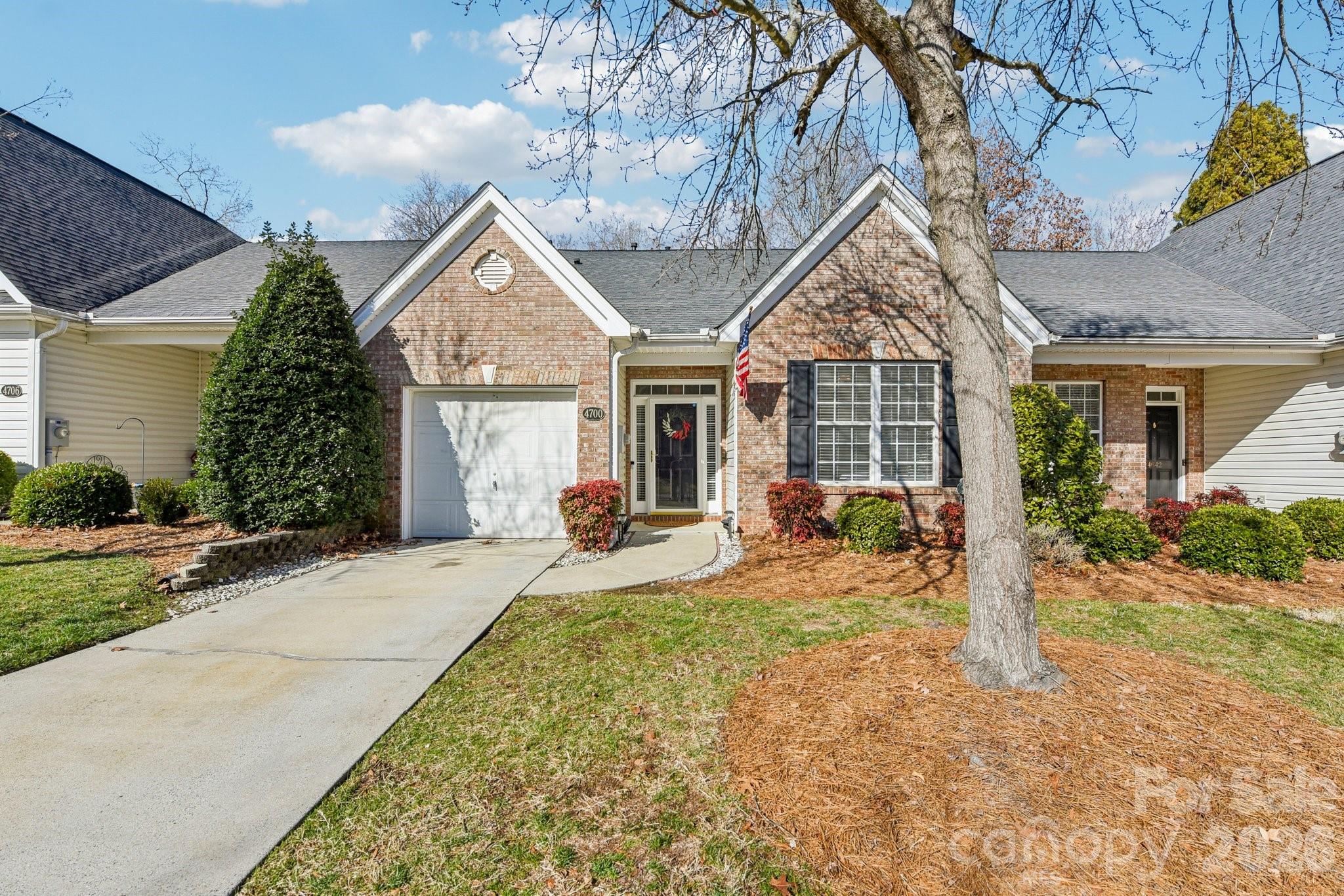 a front view of house with yard outdoor seating and barbeque oven