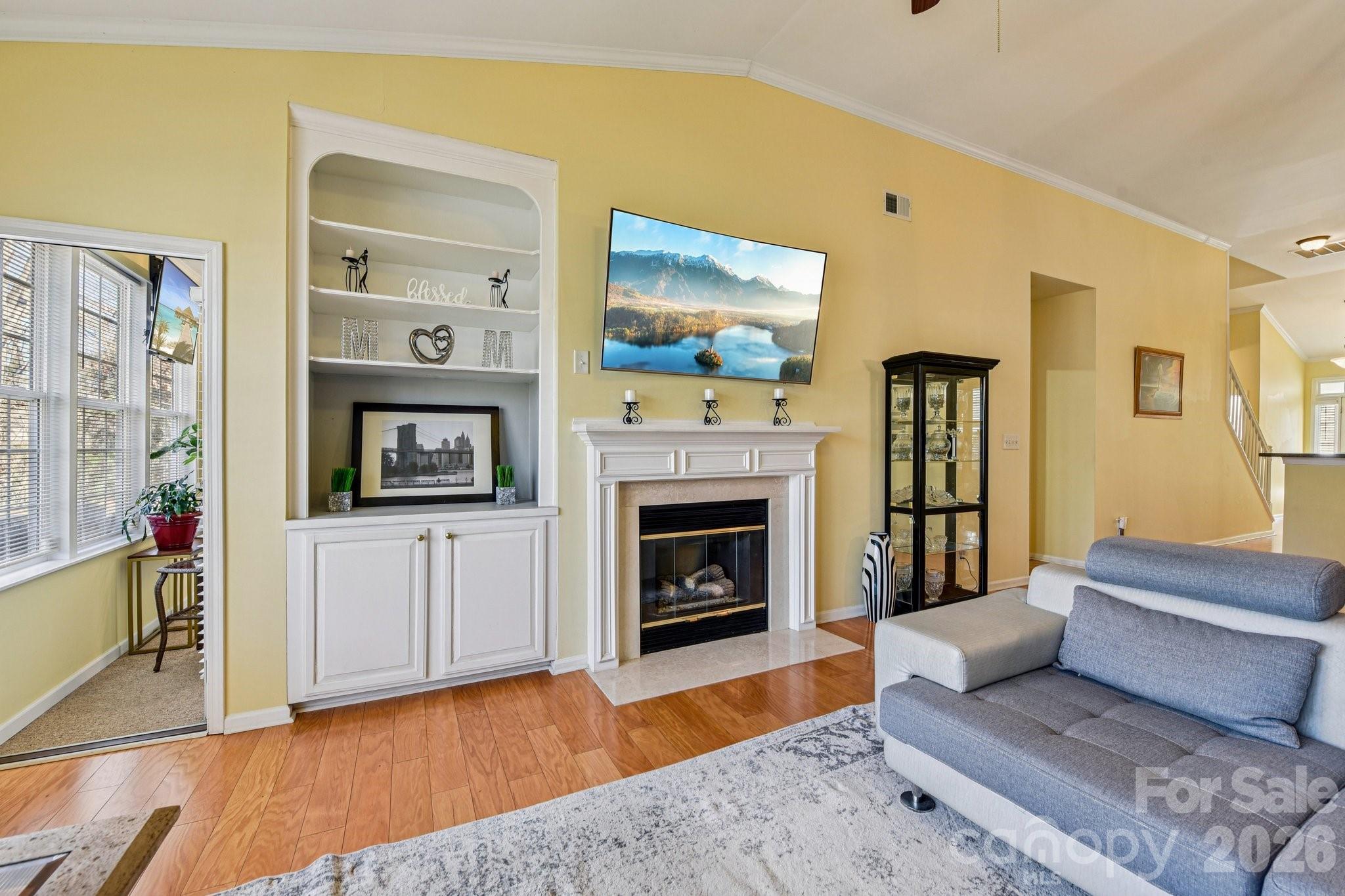 4700 Willow Glen Road Harrisburg, NC 28075 - Photo 13 of 29 a living room with furniture and a fireplace