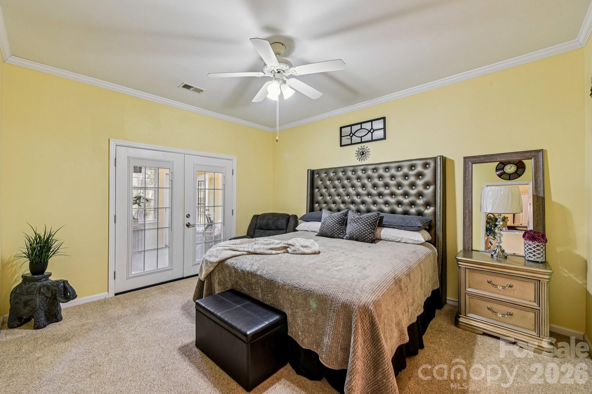 4700 Willow Glen Road Harrisburg, NC 28075 - Photo 14 of 29 a bedroom with a bed and wooden floor