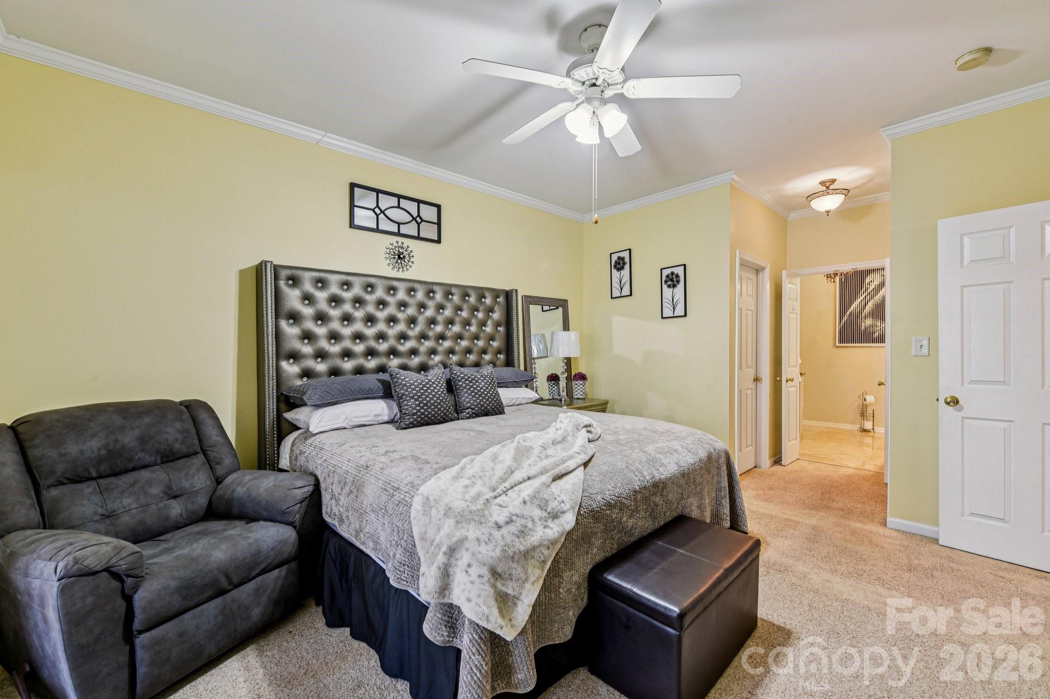4700 Willow Glen Road Harrisburg, NC 28075 - Photo 15 of 29 a bedroom with a bed couch and ceiling fan
