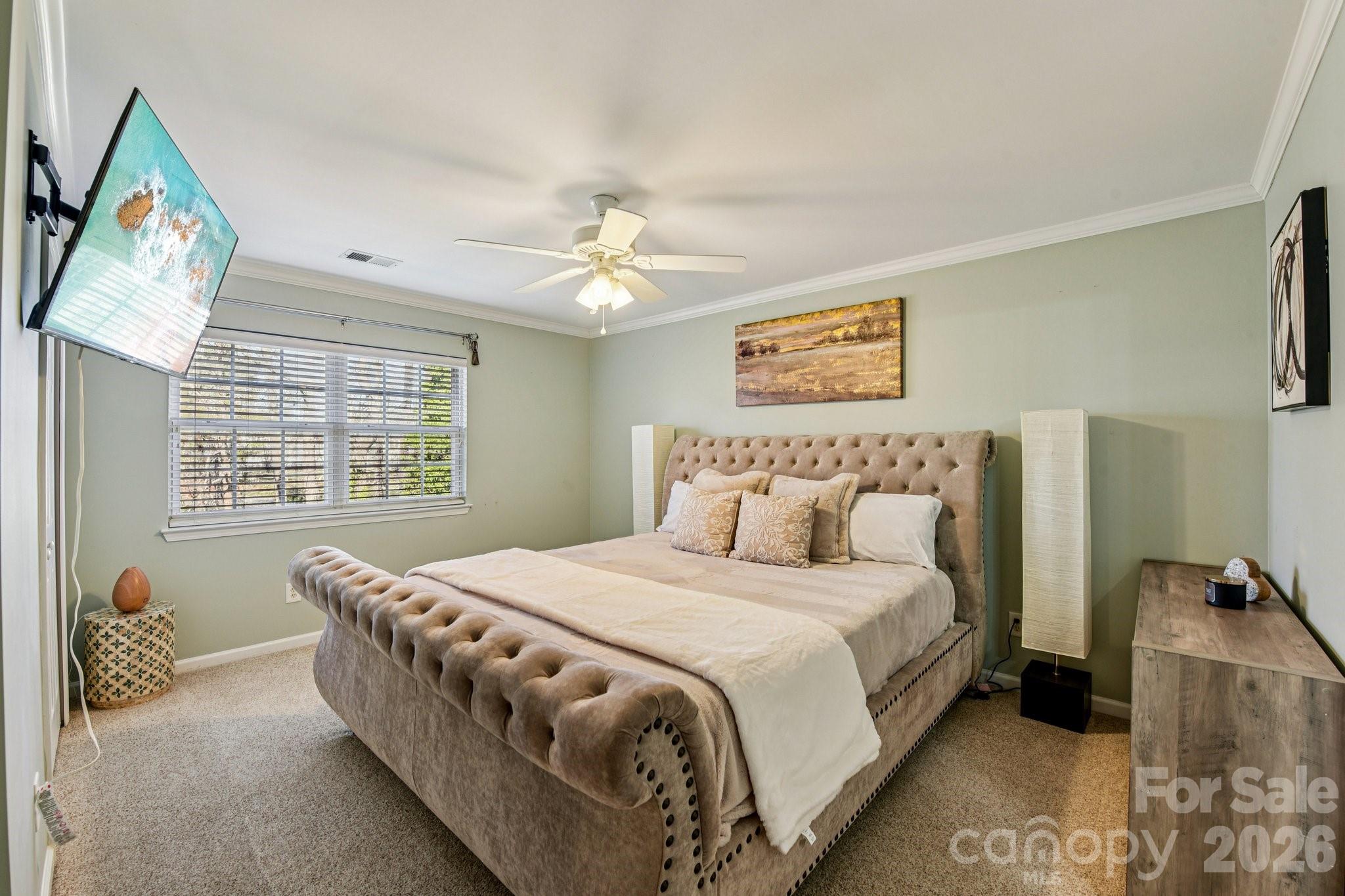 4700 Willow Glen Road Harrisburg, NC 28075 - Photo 18 of 29 a bedroom with a bed and a couch
