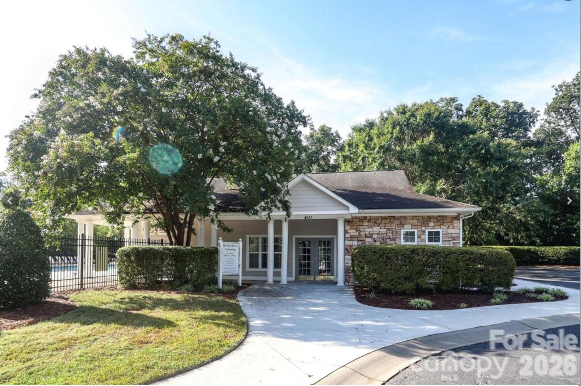 4700 Willow Glen Road Harrisburg, NC 28075 - Photo 27 of 29 a view of a house with a yard and sitting area