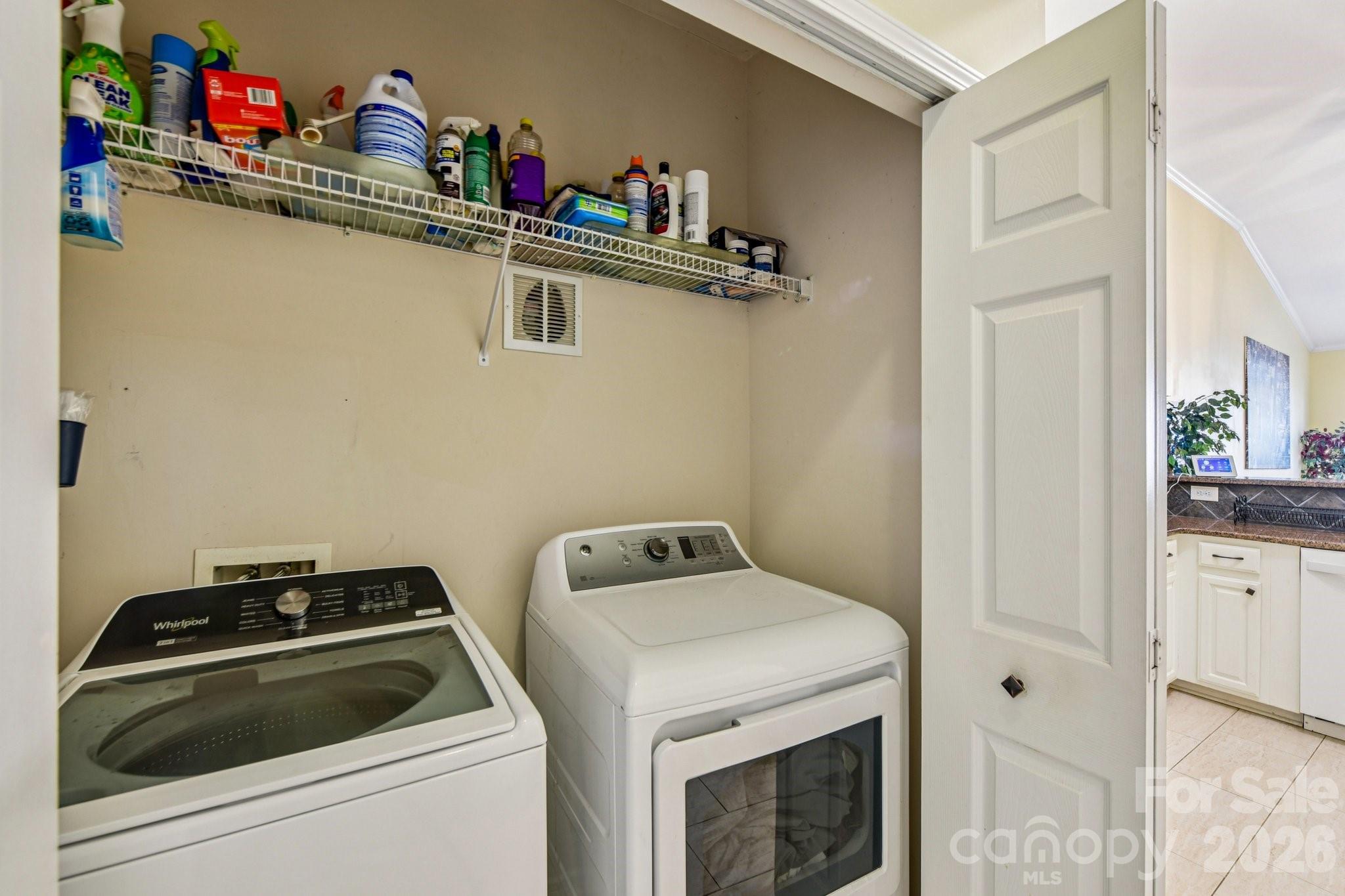 4700 Willow Glen Road Harrisburg, NC 28075 - Photo 9 of 29 a bathroom with a sink and cabinets