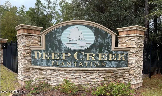 a view of outdoor space with garden and trees