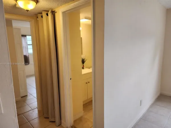 a bathroom with a shower and a mirror