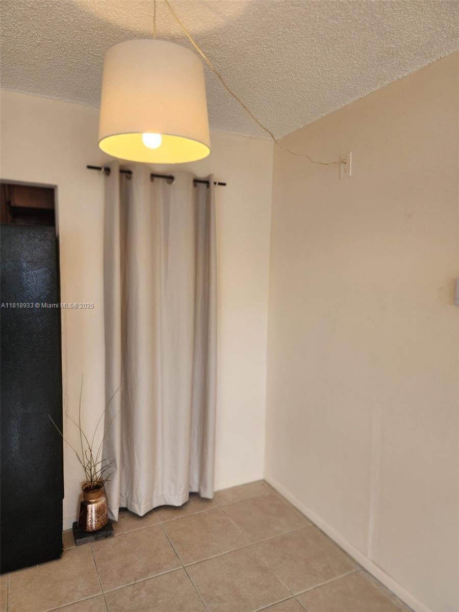 Snug Harbor Pompano Beach, FL 33060 - Photo 8 of 16 a view of entryway with chandelier