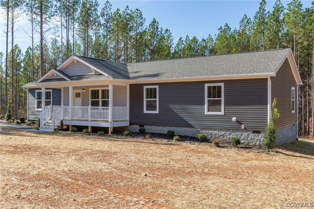 a backyard of a house with wooden floor and fence