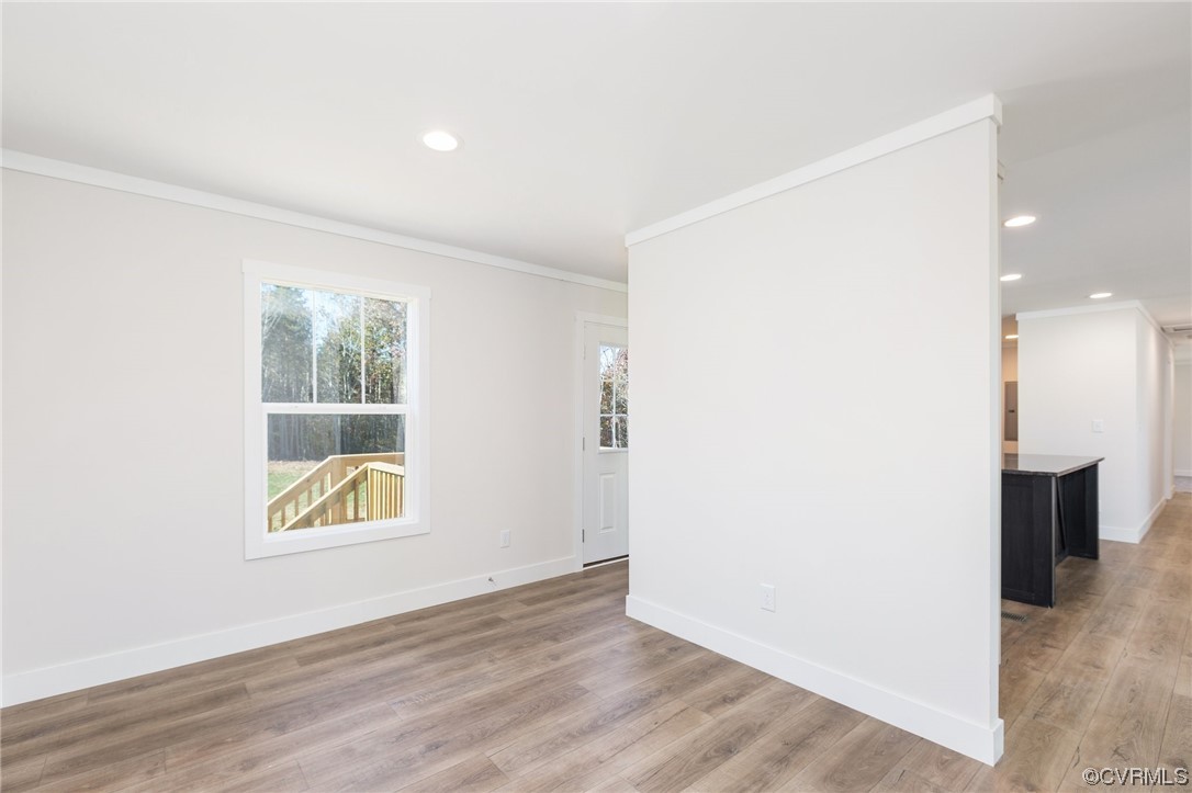 2011 Meherrin Road Meherrin, VA 23954 - Photo 17 of 37 an empty room with wooden floor and a window