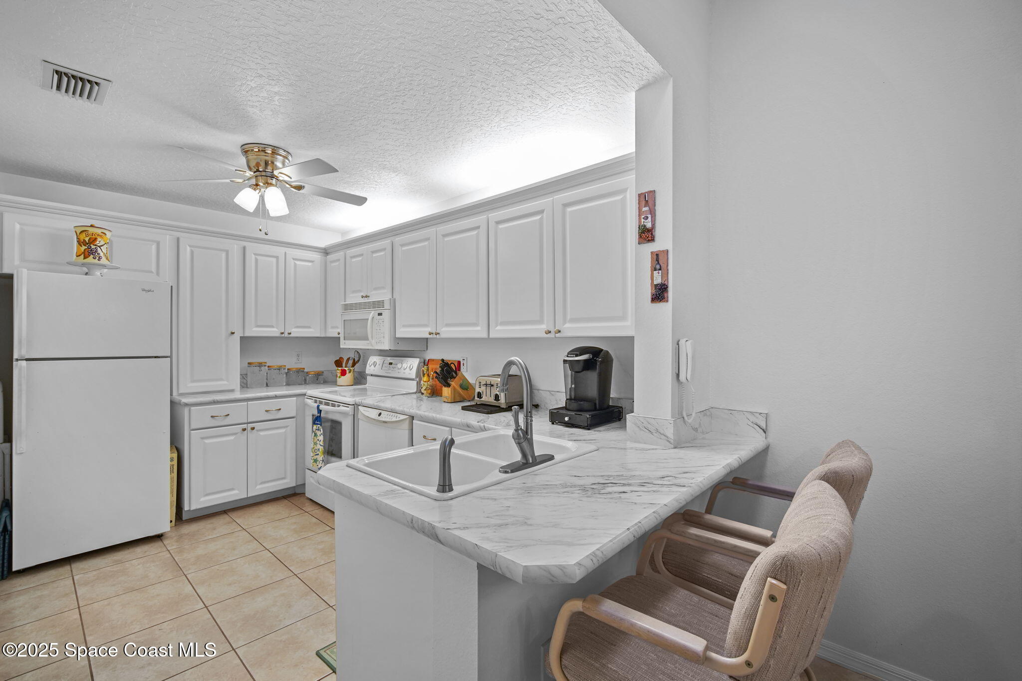 1956 Quail Ridge Court, Unit 1802 Cocoa, FL 32926 - Photo 4 of 42 13-web-or-mls-QUAIL_KITCHEN3