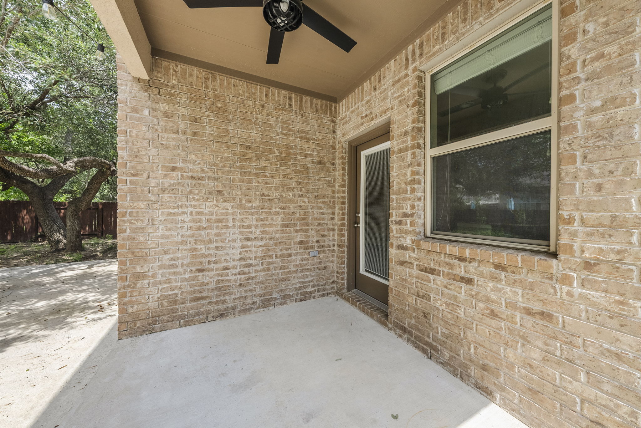4401 Trinity Woods Street Leander, TX 78641 - Photo 30 of 37 A spacious covered patio provides a delightful outdoor living extension to this brick home.