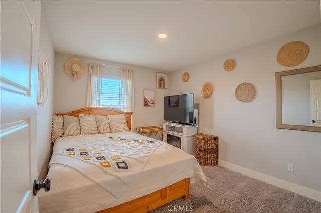 an empty room with fan and entrance