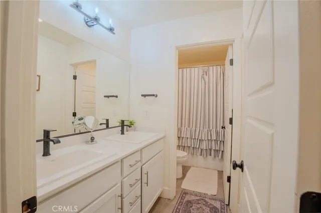 a view of a kitchen with wooden floor