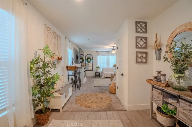 a spacious bedroom with a bed and ceiling fan