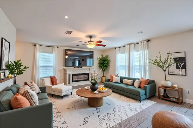 a dining room with furniture and a kitchen view