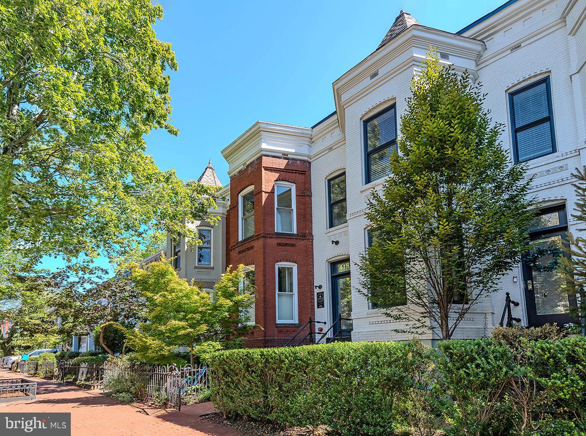 418 7th Street Southeast, Unit 302 Washington, DC 20003 - Photo 2 of 35 a front view of a house with a yard