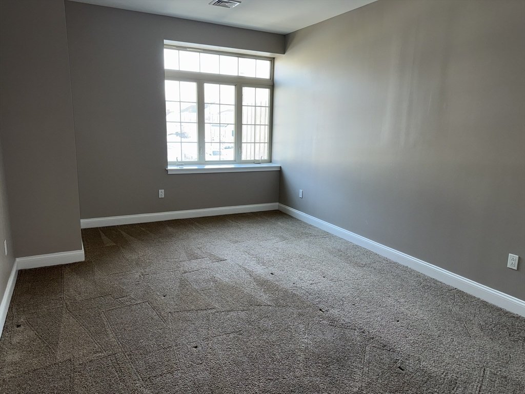 40 Heather Street, Unit 204 Beverly, MA 01915 - Photo 11 of 39 an empty room with a window