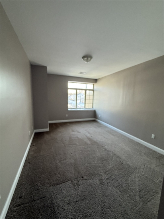 40 Heather Street, Unit 204 Beverly, MA 01915 - Photo 12 of 39 an empty room with windows