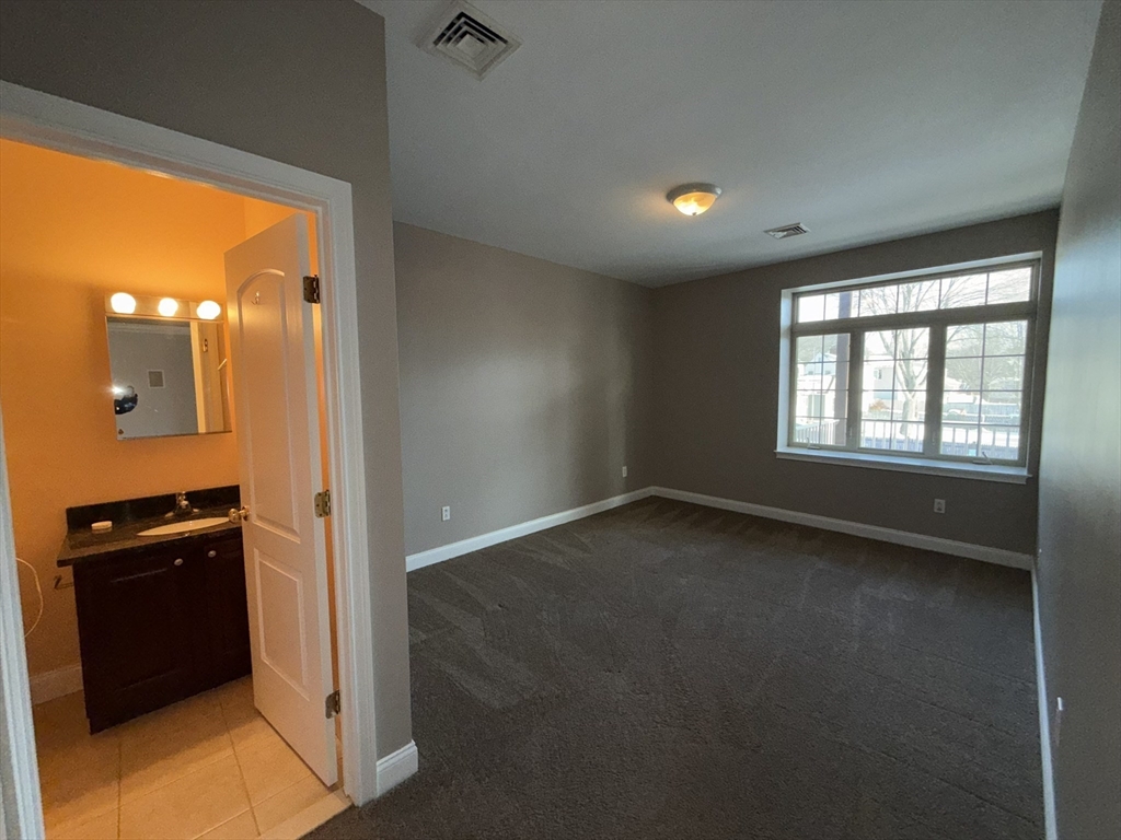 40 Heather Street, Unit 204 Beverly, MA 01915 - Photo 13 of 39 an empty room with a window