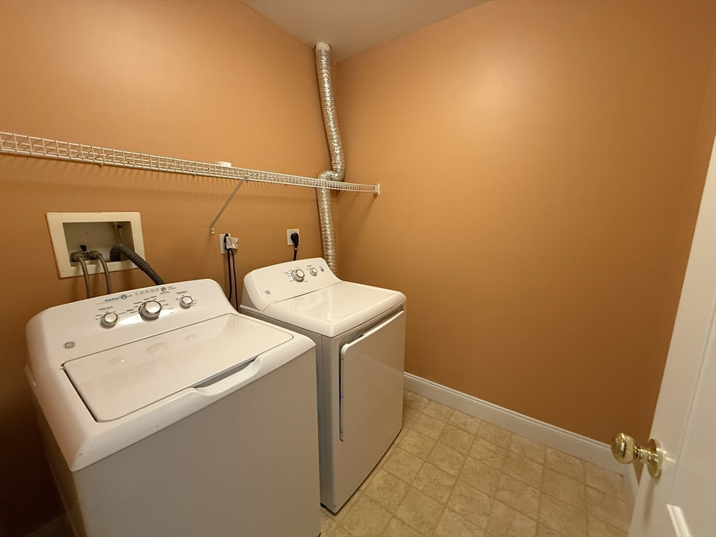 40 Heather Street, Unit 204 Beverly, MA 01915 - Photo 15 of 39 a utility room with dryer and washer