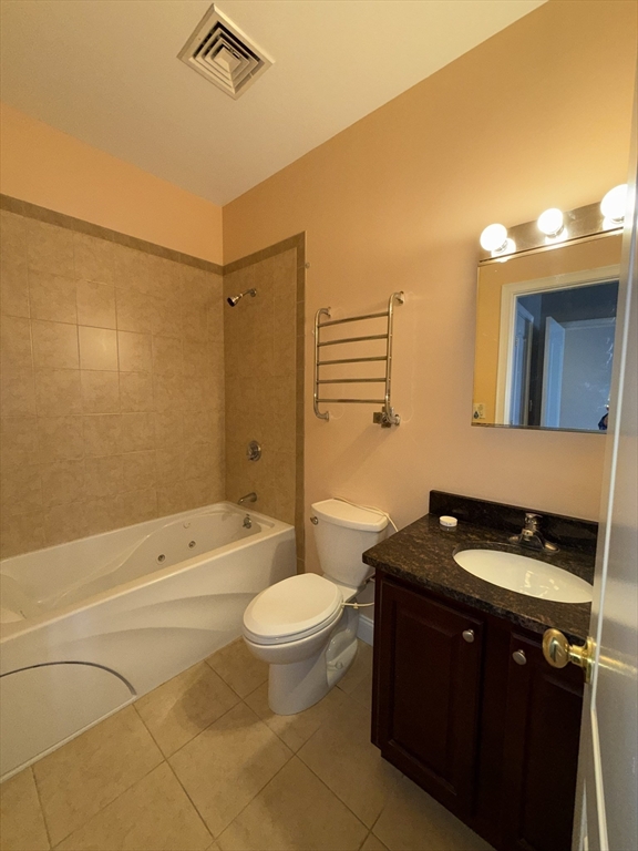 40 Heather Street, Unit 204 Beverly, MA 01915 - Photo 17 of 39 a bathroom with a sink a toilet a mirror and shower
