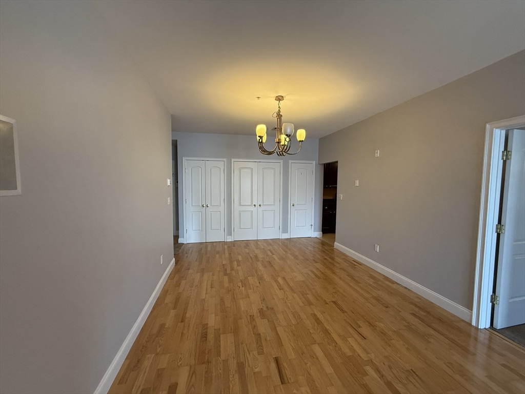 40 Heather Street, Unit 204 Beverly, MA 01915 - Photo 2 of 39 wooden floor in an empty room with a window