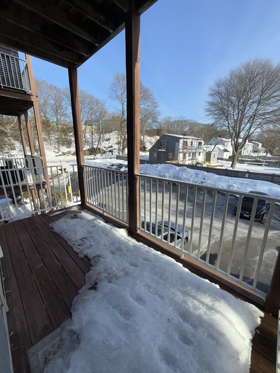 40 Heather Street, Unit 204 Beverly, MA 01915 - Photo 27 of 39 a view of a balcony with wooden floor