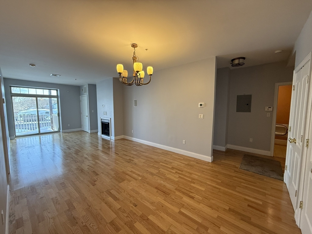 40 Heather Street, Unit 204 Beverly, MA 01915 - Photo 3 of 39 wooden floor in an empty room with a window