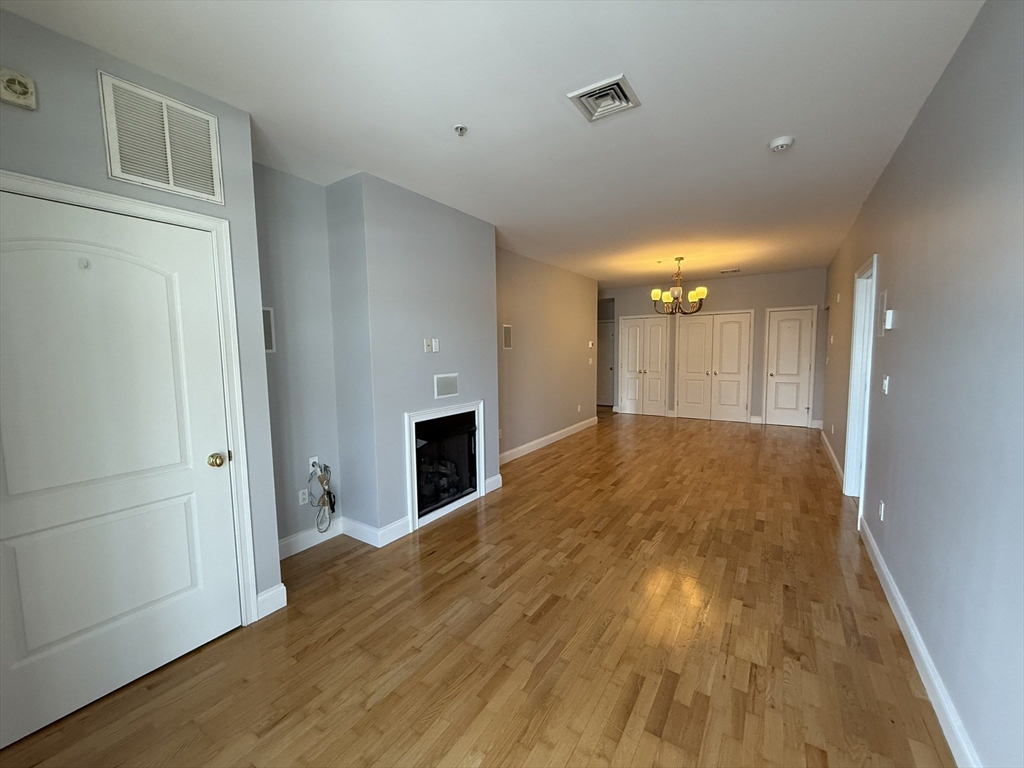 40 Heather Street, Unit 204 Beverly, MA 01915 - Photo 5 of 39 a view of empty room with wooden floor