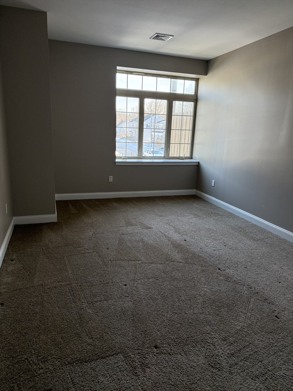 40 Heather Street, Unit 204 Beverly, MA 01915 - Photo 10 of 39 an empty room with a window