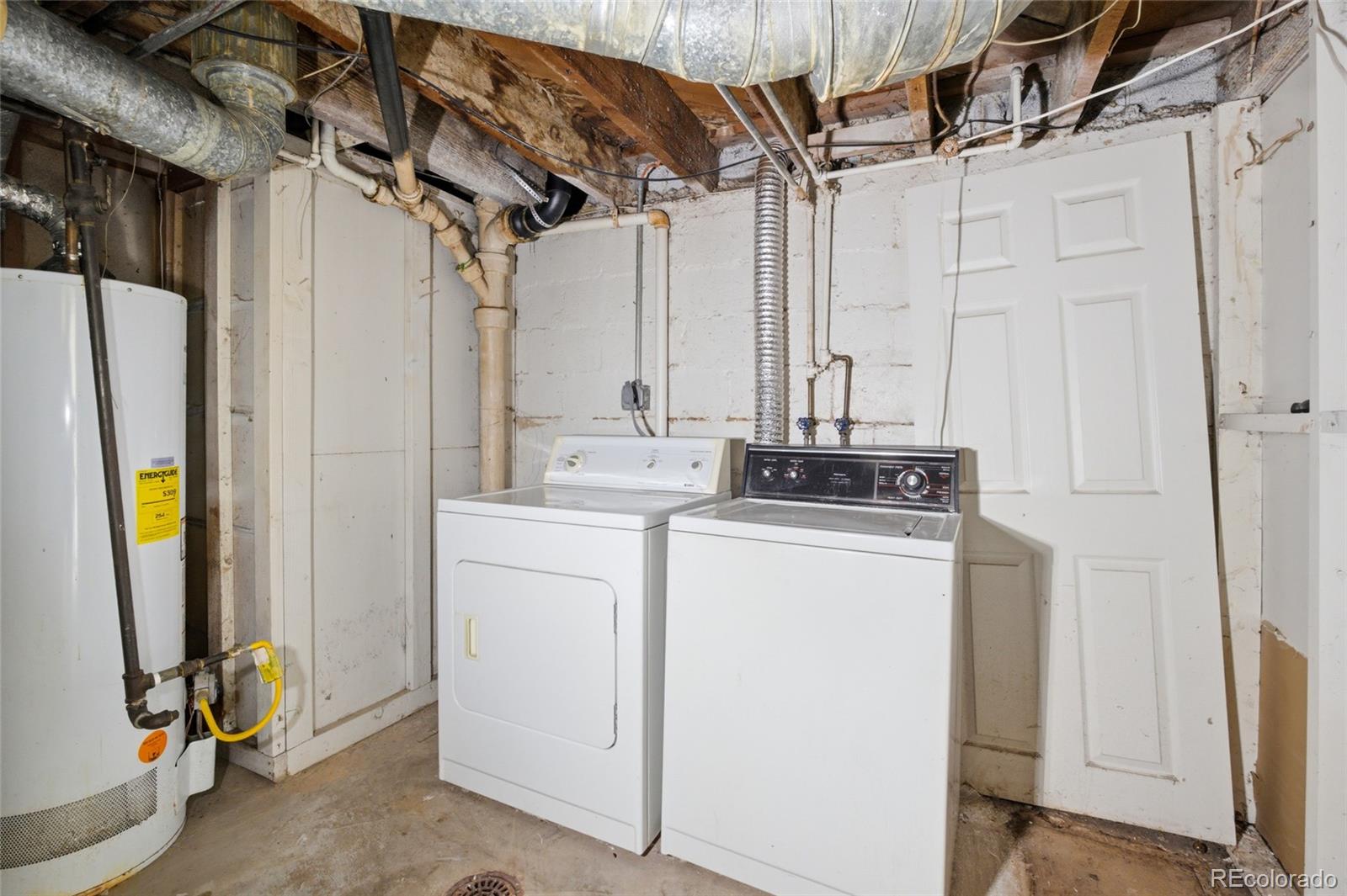 791 Quebec Street Denver, CO 80220 - Photo 16 of 17 a utility room with dryer and washer